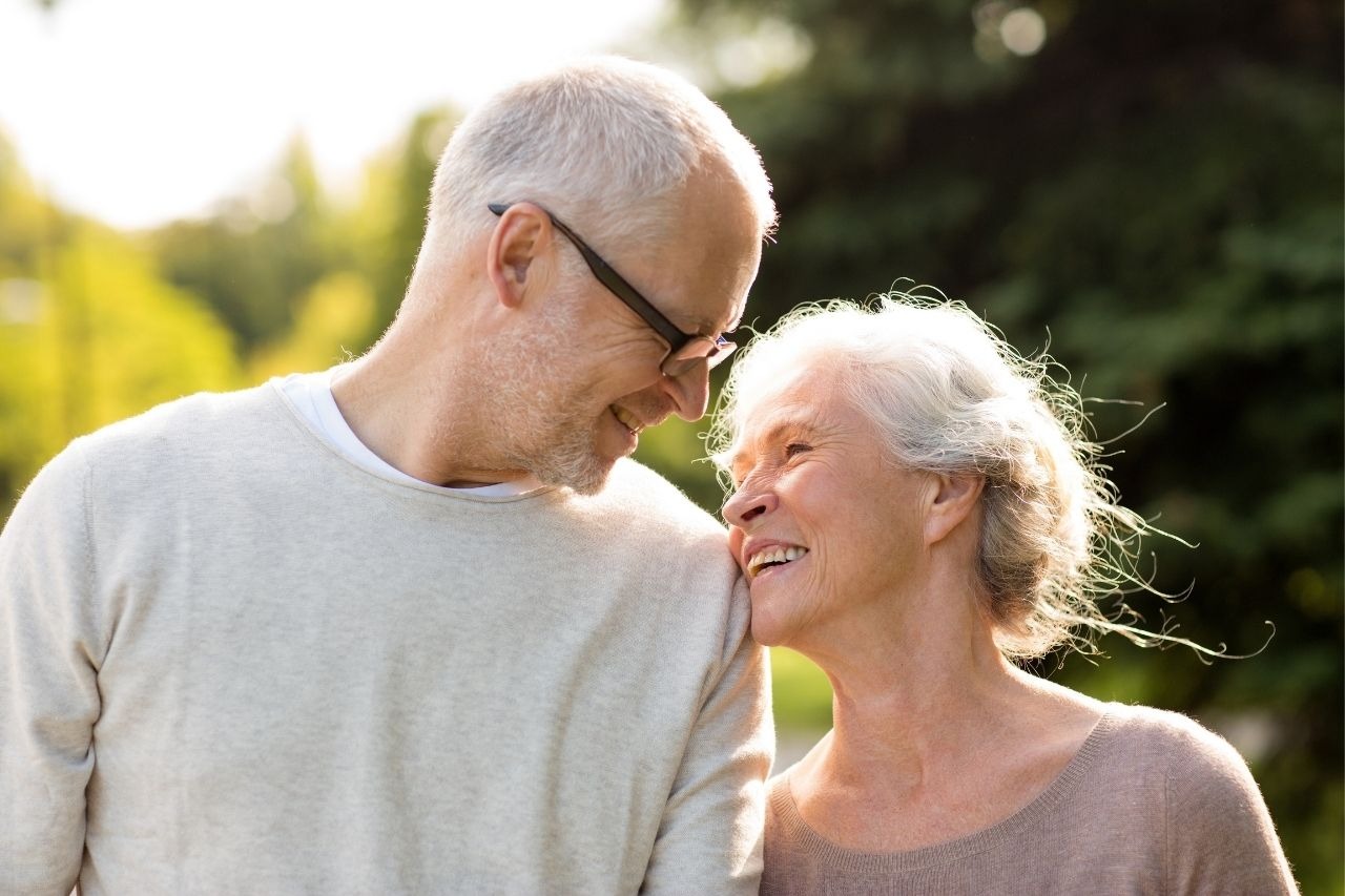 Elderly couple reviewing Medicare Advantage options on tablet